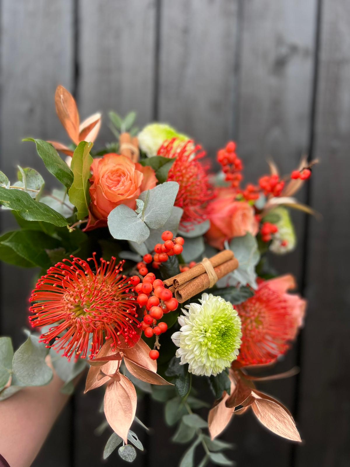 Clementine and Cinnamon Hand tie Bouquet