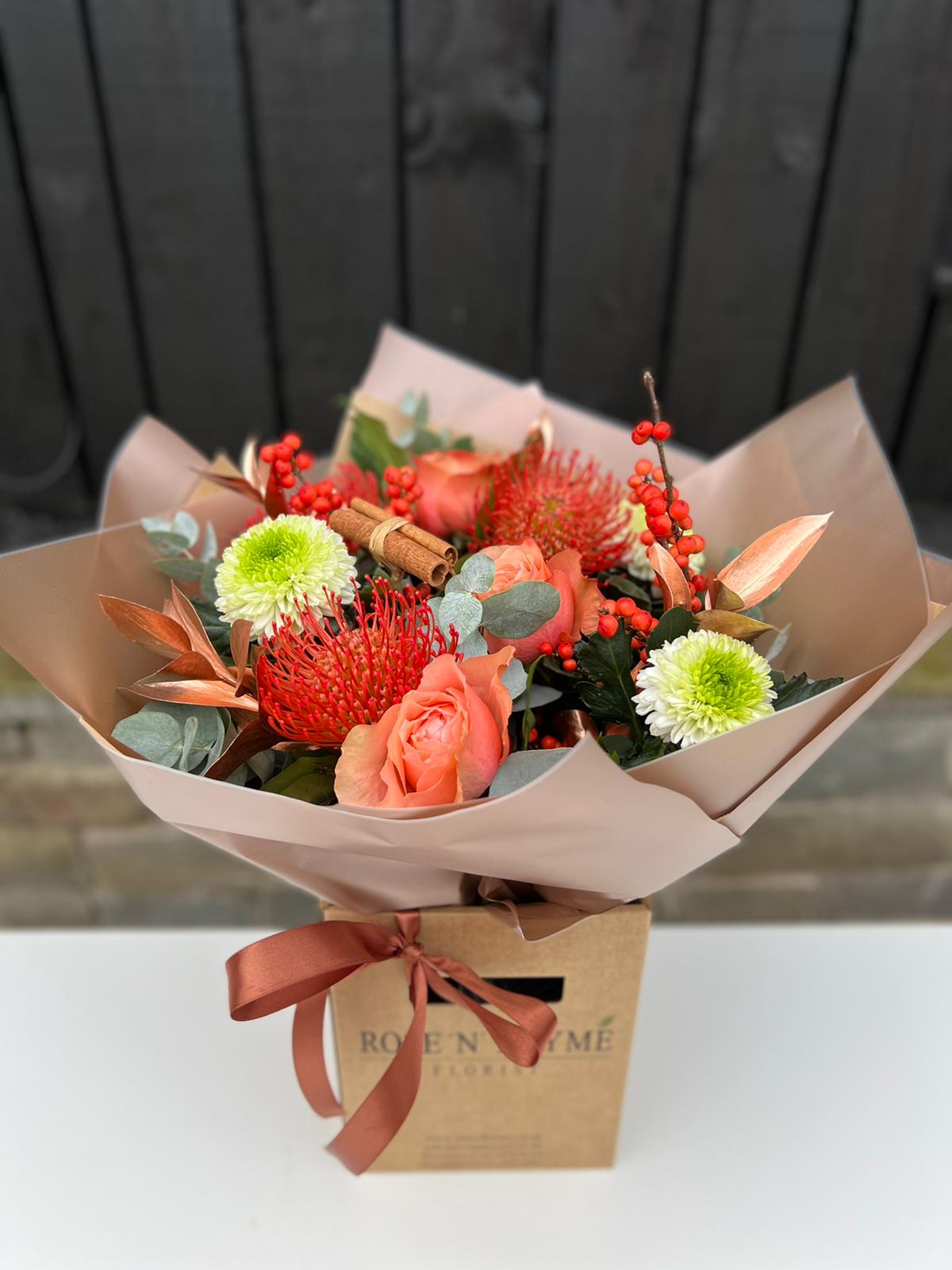 Clementine and Cinnamon Hand tie Bouquet